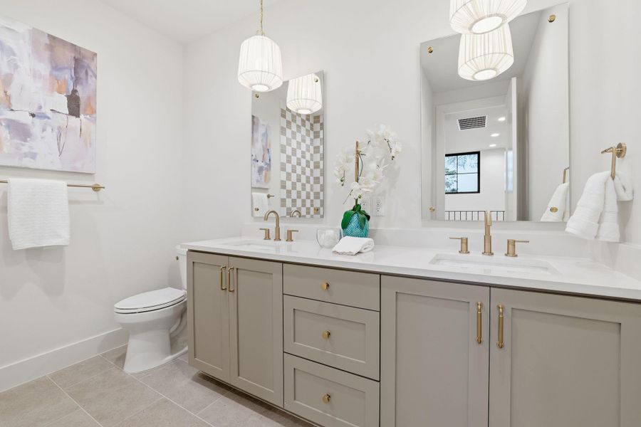 Full bathroom featuring light tile patterned flooring and double vanity