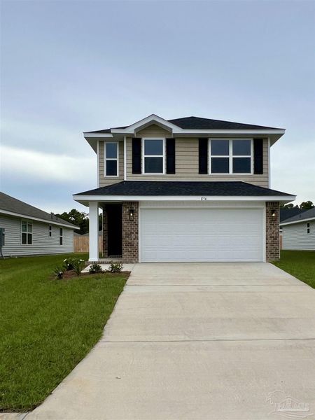 Front exterior of a new home in Allison Acres, Cantonment, FL, highlighting curb appeal (Image 1).