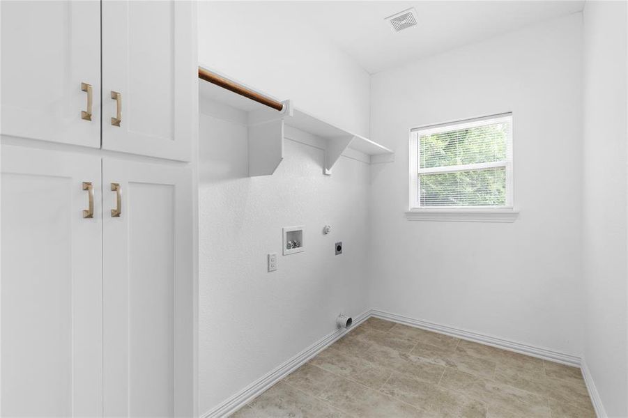Laundry area with hookup for a gas dryer, electric dryer hookup, and washer hookup Laundry area with hookup for a gas dryer, electric dryer hookup, and washer hookup