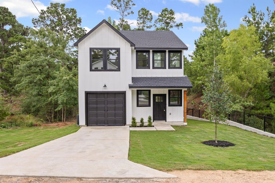 View of front of home featuring roof with shingles, a garage, board and batten siding, and concrete driveway View of front of home featuring roof with shingles, a garage, board and batten siding, and concrete driveway