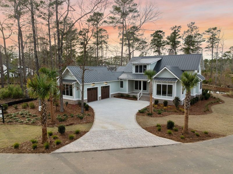 Front exterior of a new home in , Ravenel, SC, highlighting curb appeal (Image 26).