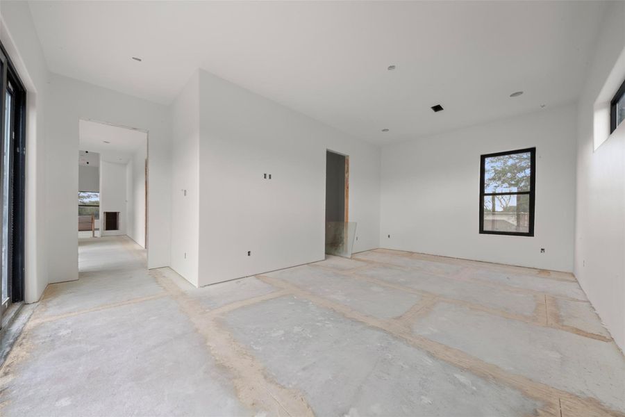 Secondary bedroom with west balcony access.