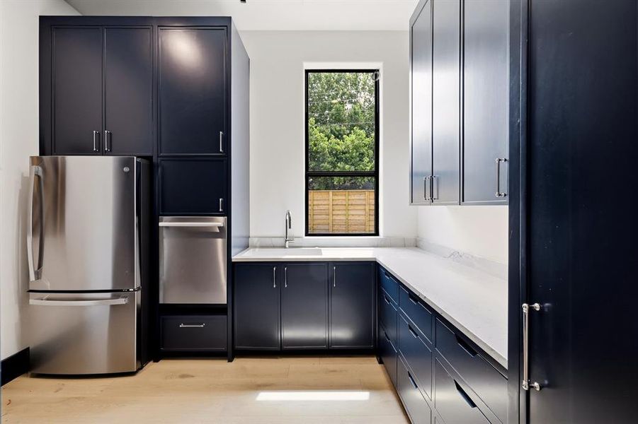 Hidden scullery and pantry off of kitchen