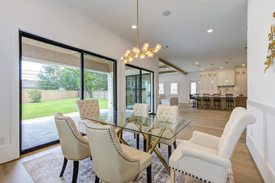 Elegant dining chandelier. Ultra–energy-efficient LED bulbs lighting throughout.