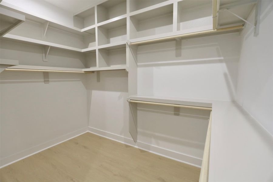 The dedicated hanging section is thoughtfully designed for suits and dresses, complete with overhead storage to keep garments pristine and accessories organized. The dedicated hanging section is thoughtfully designed for suits and dresses, complete with overhead storage to keep garments pristine and accessories organized.