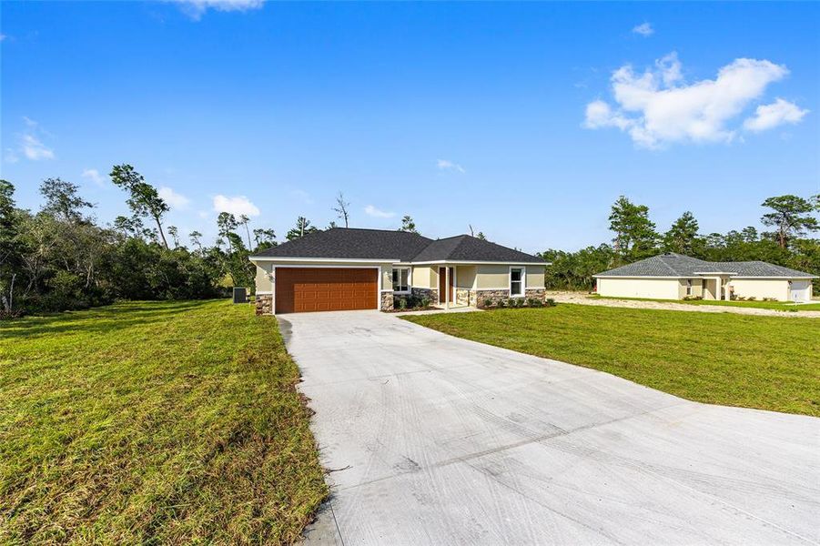 Front exterior of a new home in , Ocala, FL, highlighting curb appeal (Image 29).