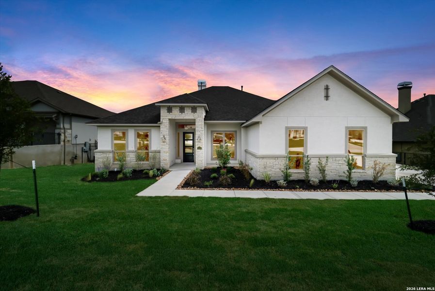 Front exterior of a new home in Johnson Ranch, Bulverde, TX, highlighting curb appeal (Image 22). Front exterior of a new home in Johnson Ranch, Bulverde, TX, highlighting curb appeal (Image 22).