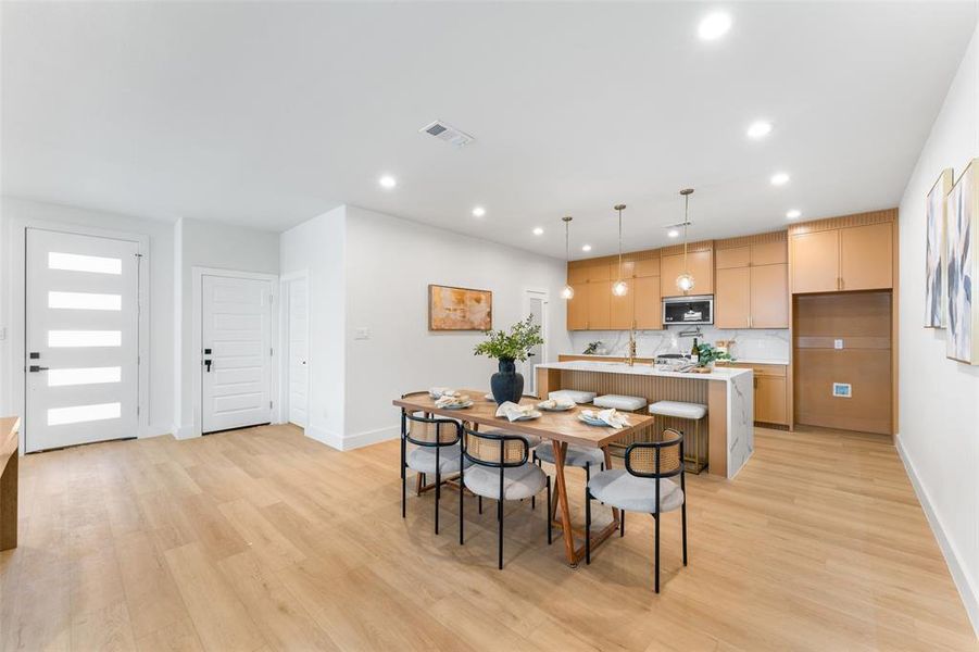 Dining area featuring recessed lighting and light wood finished floors