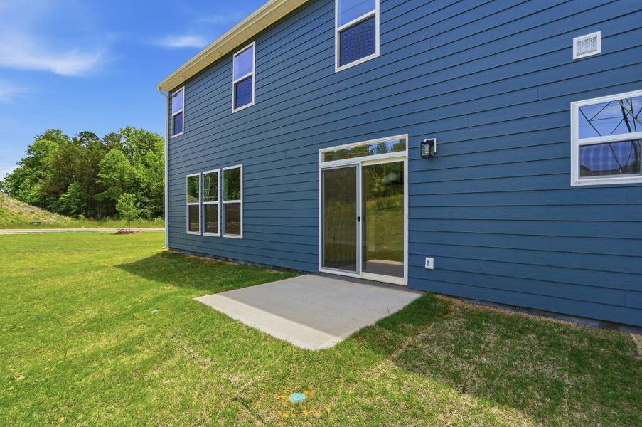 Exterior details and patio area of a home in Enclave at Riverdale, Huntersville (Image 4).