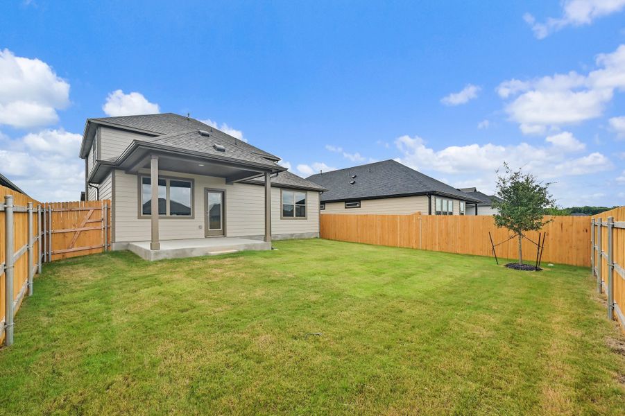 Exterior details and patio area of a home in Prairie Winds, Hutto (Image 4).