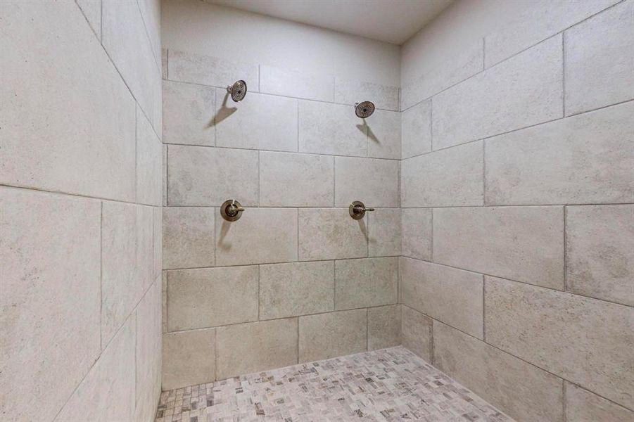 Room details featuring tiled shower