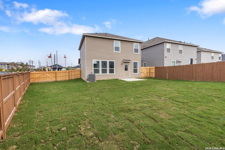 Exterior details and patio area of a home in Southton Cove, Elmendorf (Image 4).