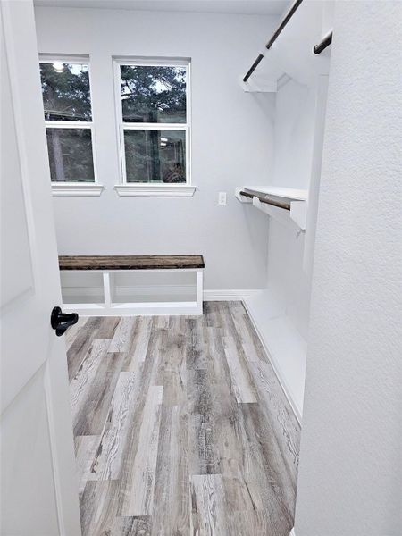 Entering to primary walk-in closet.