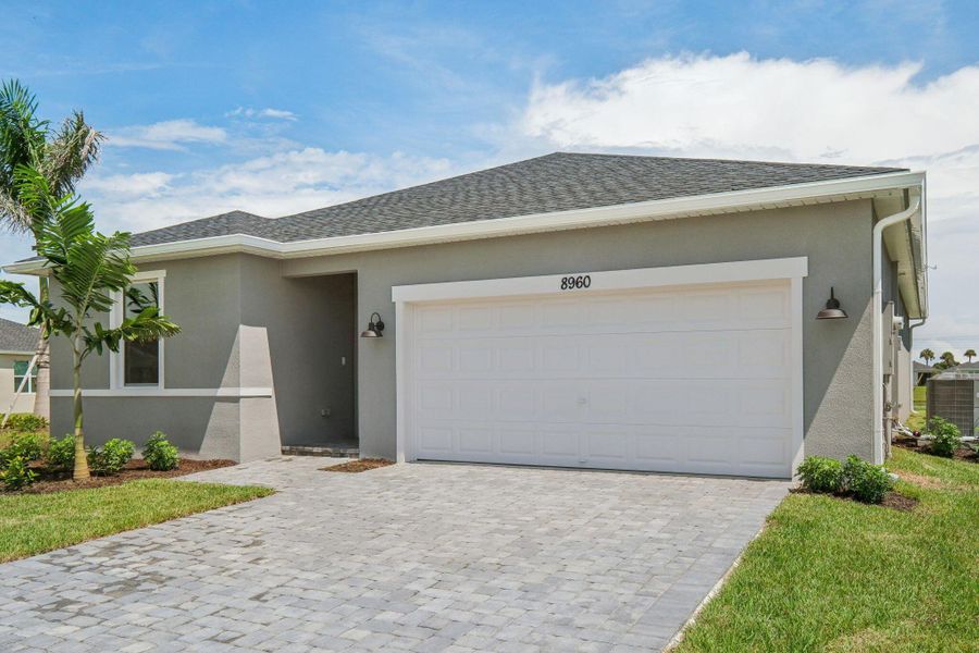 Front exterior of a new home in Azalea, Port St. Lucie, FL, highlighting curb appeal (Image 28).