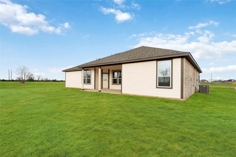 Exterior details and patio area of a home in Southfork Ranch, Sealy (Image 3).