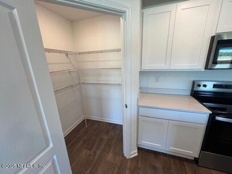 Furnished interior view inside a new home in Sawmill Branch Express, Palm Coast (Image 8).
