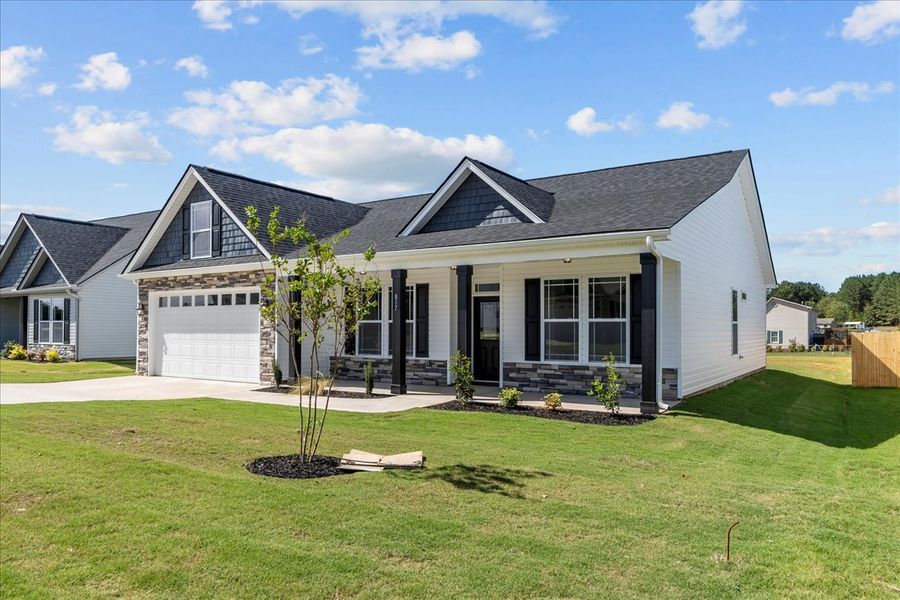 Representative exterior photo of a completed home built from the Cherokee by Enchanted Homes in Lonesome Dove, San Antonio, TX (Image 26).