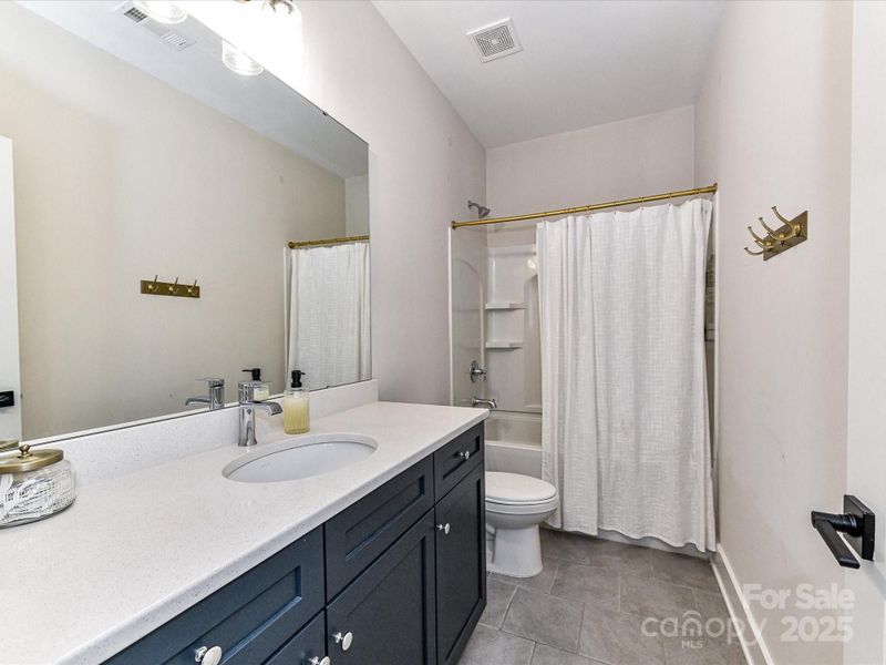 Full Bath on upper level with tub/shower & tile flooring!