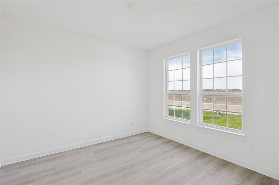 Unfurnished room with light hardwood / wood-style floors