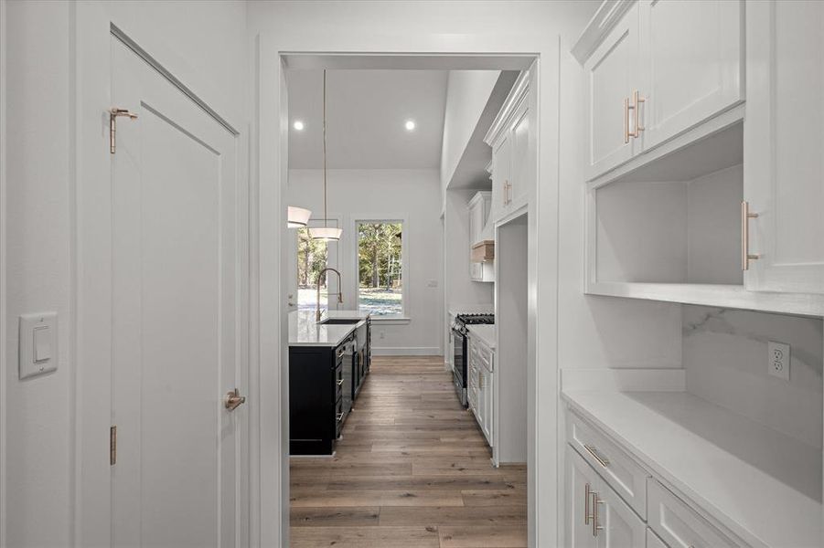 Pantry and butler pantry connecting dining room to kitchen