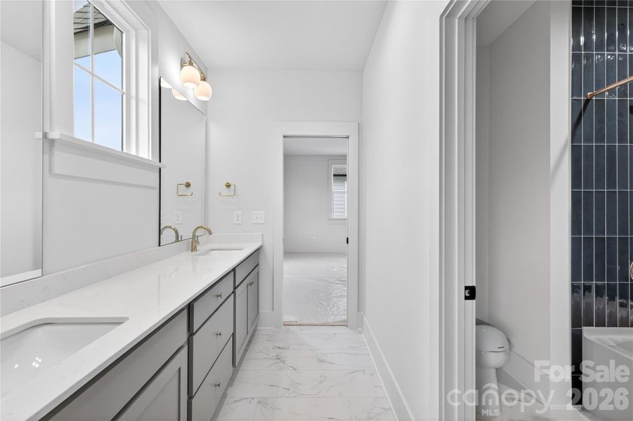 Bath #2 Offers Dual vanity with beautiful upgraded tile shower. Bath #2 Offers Dual vanity with beautiful upgraded tile shower.