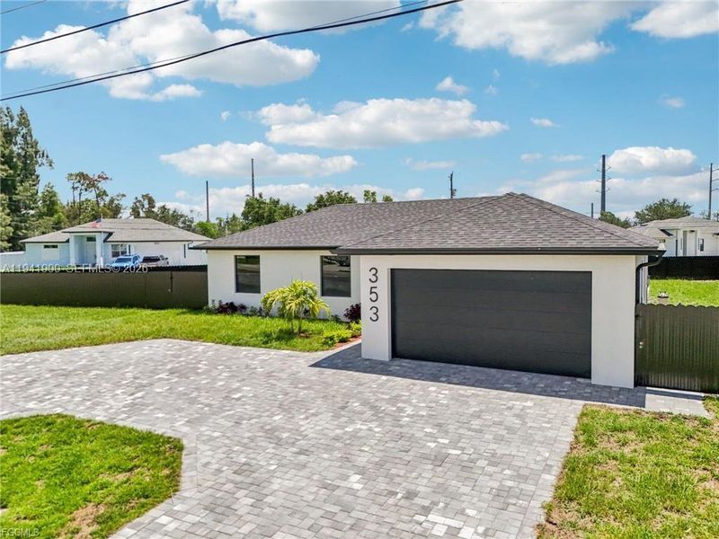 Front exterior of a new home in , Cape Coral, FL, highlighting curb appeal (Image 21).