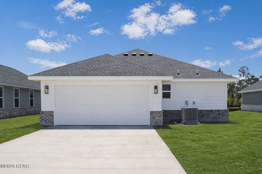 Front exterior of a new home in East Bay, Panama City, FL, highlighting curb appeal (Image 15).