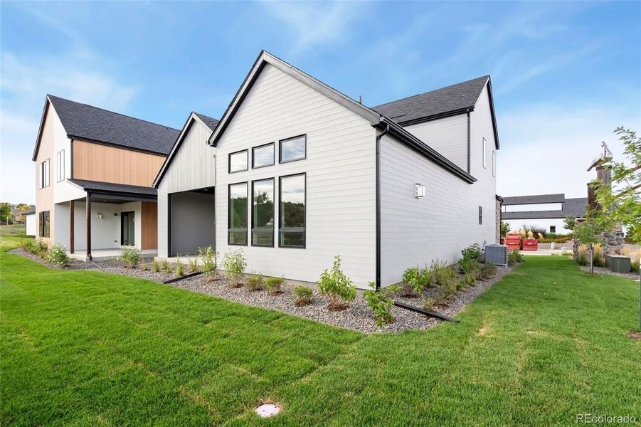 Exterior details and patio area of a home in Pelican Shores at Water Valley, Windsor (Image 3). Exterior details and patio area of a home in Pelican Shores at Water Valley, Windsor (Image 3).