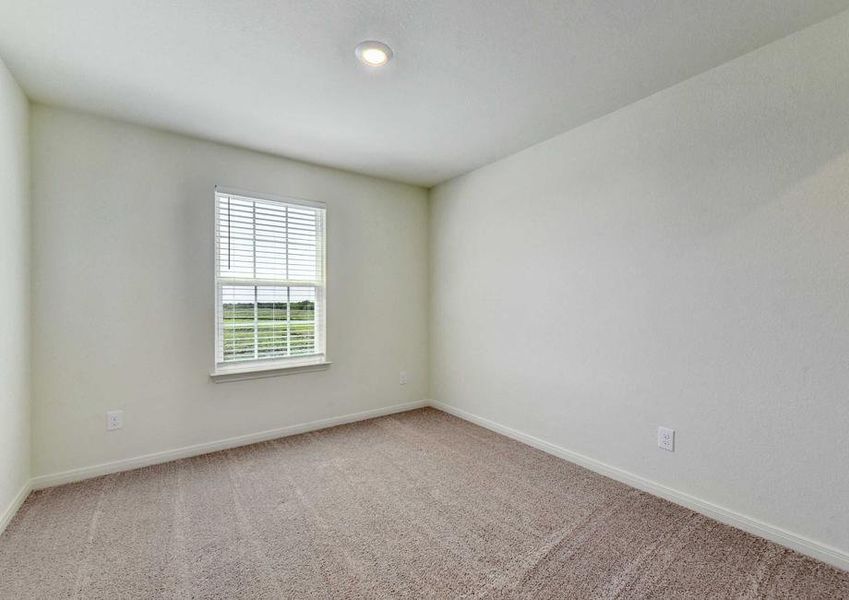 Rio bedroom with carpet floors, can light, and large white frame window