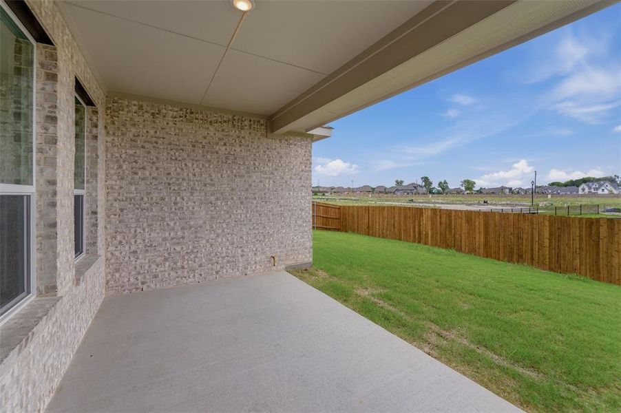 Exterior details and patio area of a home in Cedar Ridge Estates, Anna (Image 3).