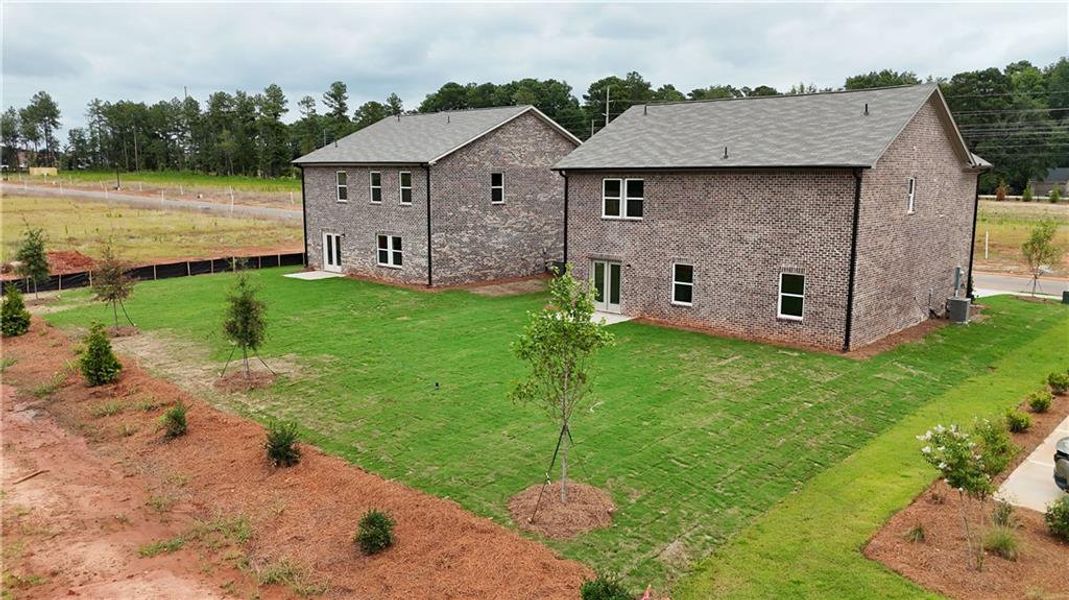 Front exterior of a new home in Kendall Grove, McDonough, GA, highlighting curb appeal (Image 7). Front exterior of a new home in Kendall Grove, McDonough, GA, highlighting curb appeal (Image 7).