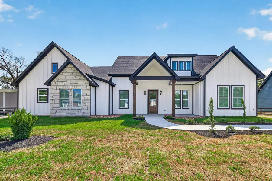 Beautiful custom modern farmhouse situated on a spacious ½-acre lot with fresh landscaping and welcoming curb appeal.