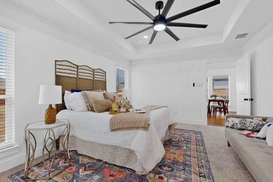 Primary bedroom with ceiling fan and recessed lighting Primary bedroom with ceiling fan and recessed lighting