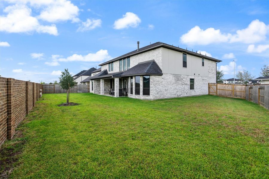 Wide backyard and rear exterior view
