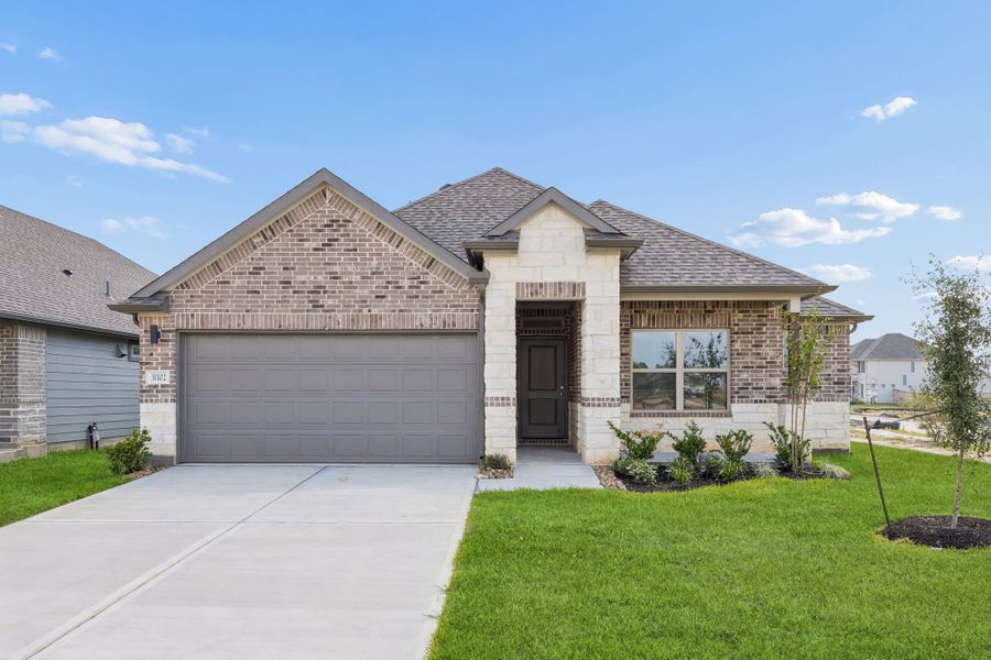 Front exterior of a new home in Riviera Pines, Huffman, TX, highlighting curb appeal (Image 1). Front exterior of a new home in Riviera Pines, Huffman, TX, highlighting curb appeal (Image 1).