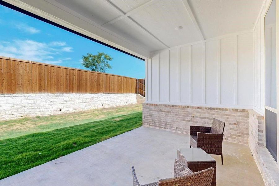 Fenced backyard with a patio