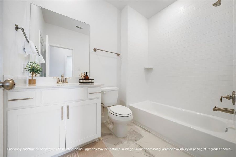 Elegant Secondary Bathroom – A thoughtfully designed bathroom featuring modern subway tiles, quartz counters, and sleek finishes.