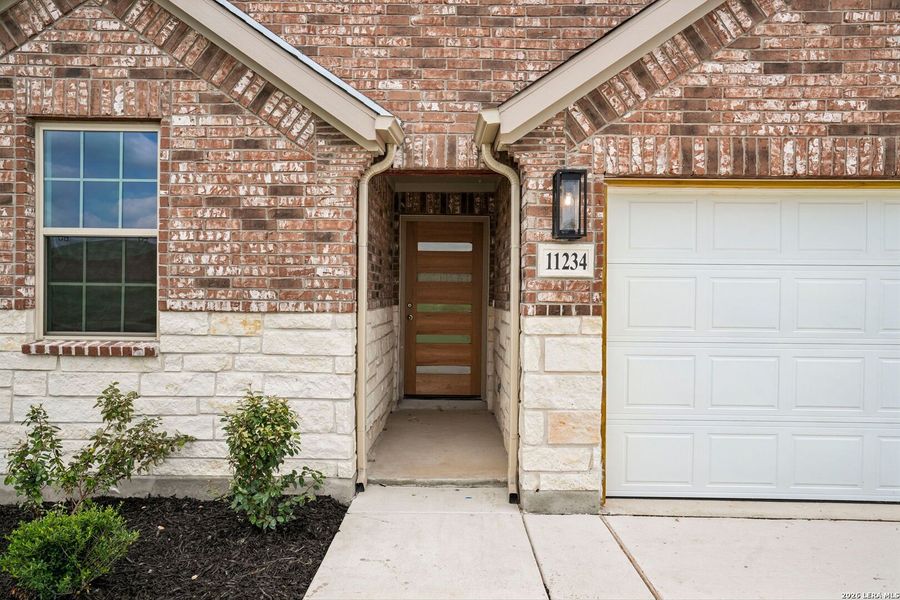 Exterior details and patio area of a home in Prairie Green, Converse (Image 17).