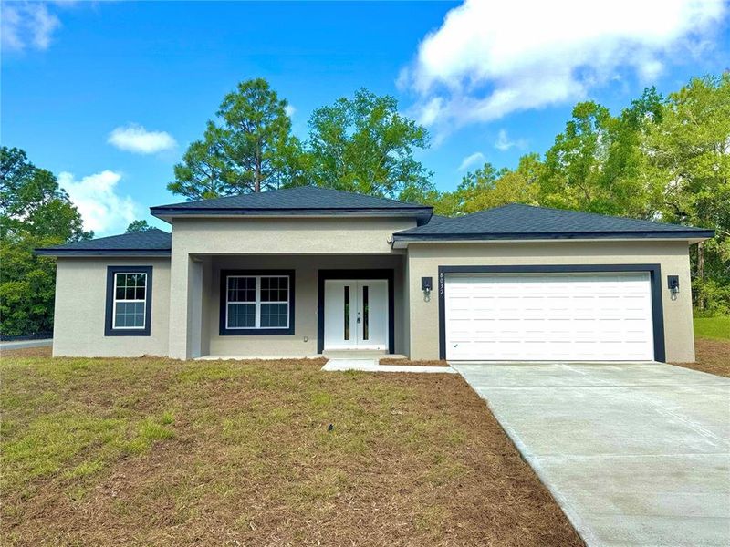 Front exterior of a new home in , Dunnellon, FL, highlighting curb appeal (Image 14).