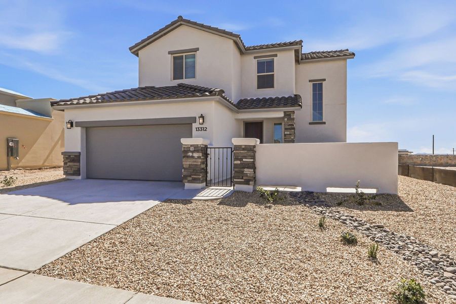 Front exterior of a new home in Emerald Estates, El Paso, TX, highlighting curb appeal (Image 2).