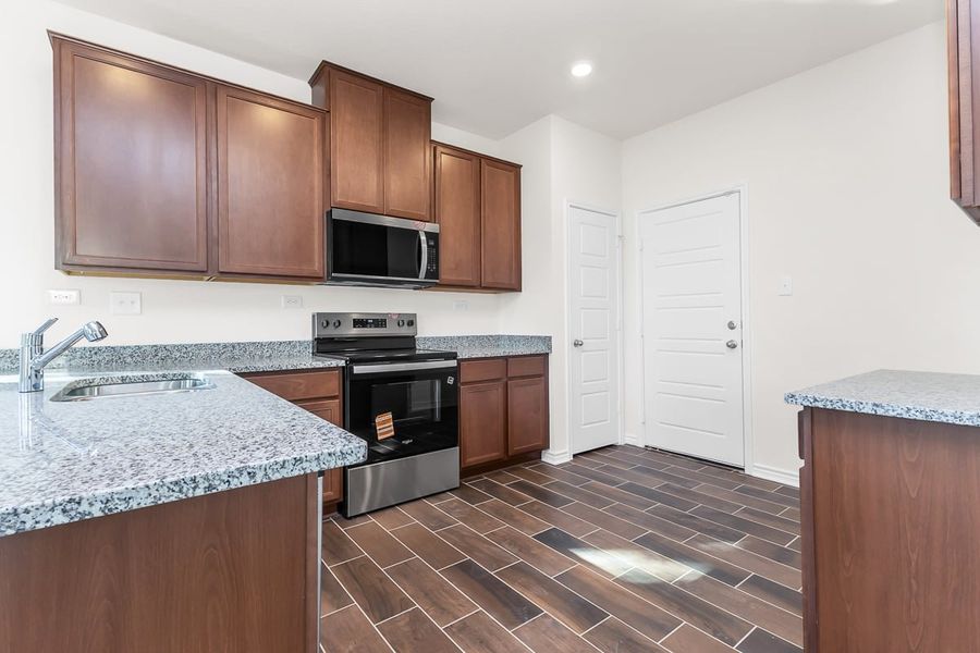 Furnished interior view inside a new home in Spanish Trails Villas, San Antonio (Image 4).