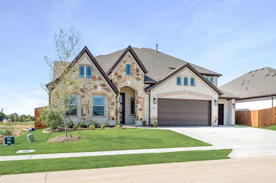 Front exterior of a new home in Timberbrook 3B-4A, Justin, TX, highlighting curb appeal (Image 24). Front exterior of a new home in Timberbrook 3B-4A, Justin, TX, highlighting curb appeal (Image 24).