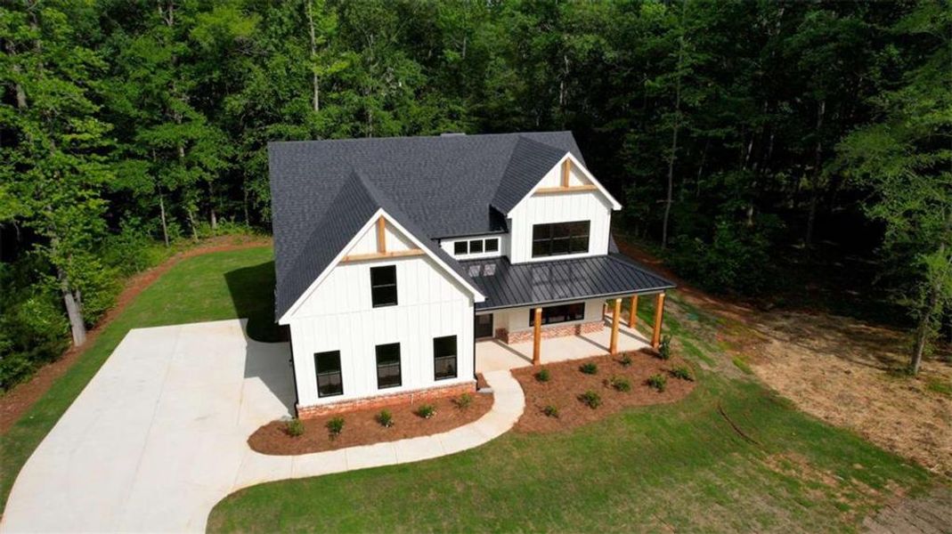 Front exterior of a new home in , Monticello, GA, highlighting curb appeal (Image 32).