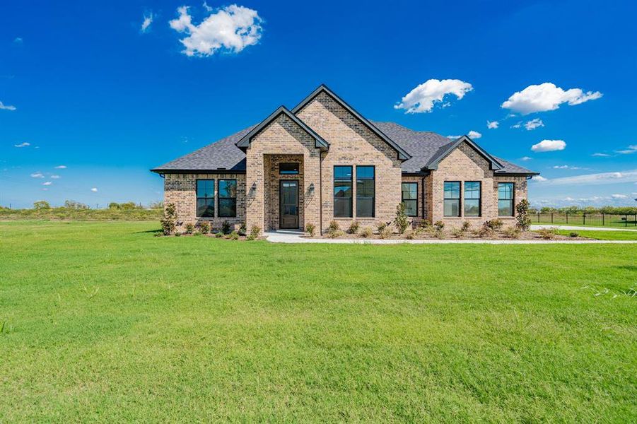 Craftsman-style home with a front lawn