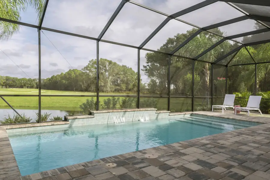Exterior details and patio area of a home in Boca Royale Golf & Country Club at Wellen Park, Englewood (Image 3).