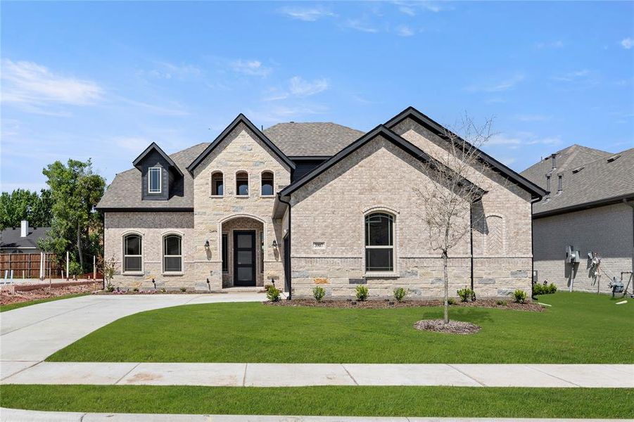 Front exterior of a new home in Lake Shore Village, Rowlett, TX, highlighting curb appeal (Image 2).