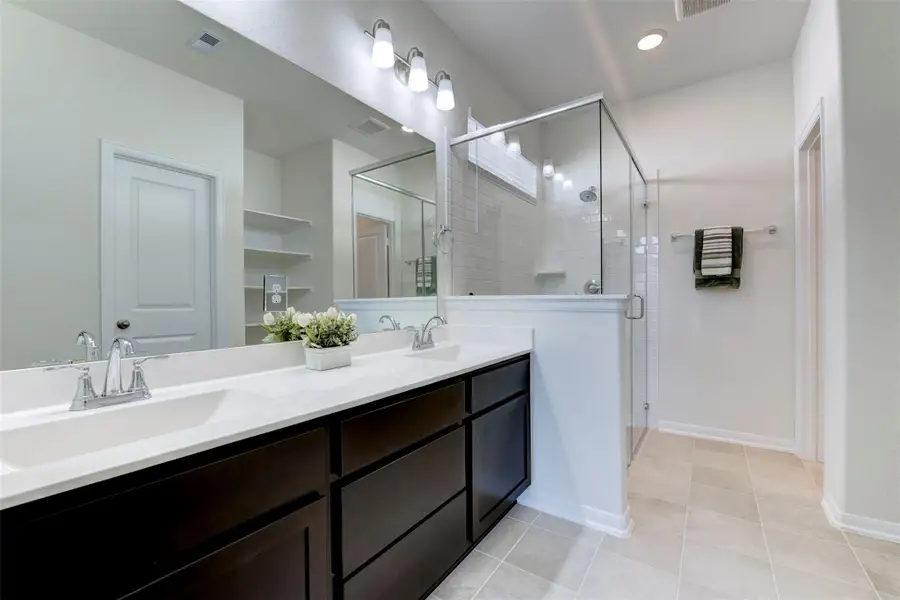 Furnished interior view inside a new home in Sunterra, Katy (Image 12).