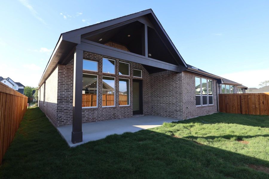 Exterior details and patio area of a home in Woodson’s Reserve, Spring (Image 4).