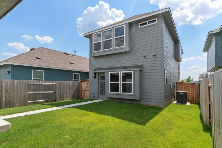 Rear view of property with a fenced backyard Rear view of property with a fenced backyard