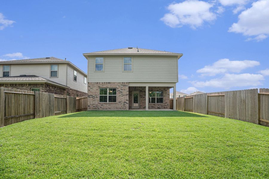 Front exterior of a new home in Bayou Maison, Dickinson, TX, highlighting curb appeal (Image 2).